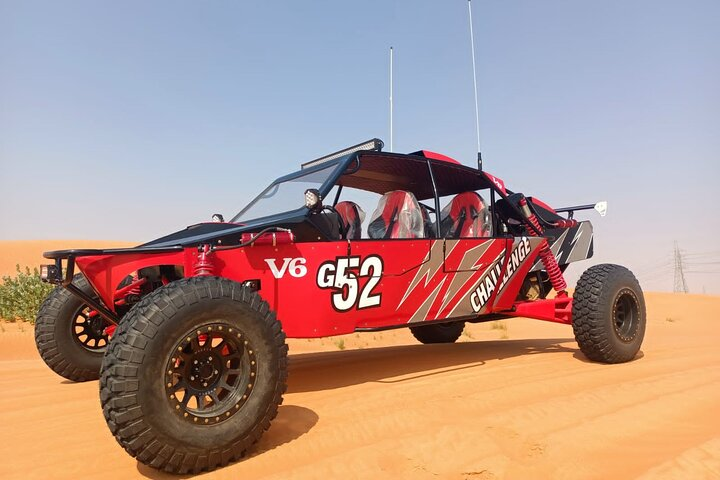 Experience the vast golden dunes of Dubai while riding in the cutting-edge Desert Challenge Buggy crafted for unforgettable adventures with friends or family. Perfect for desert exploration!